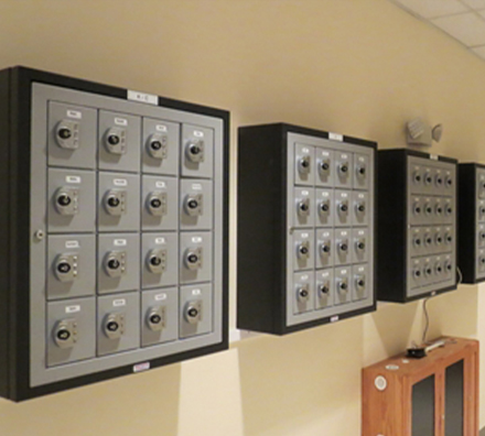 Phone storage locker mounted to the wall
